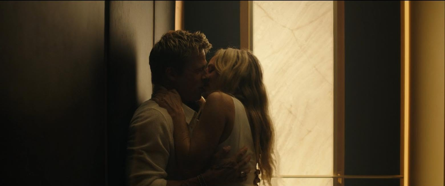 Sonny and Kate kissing in F1 The Movie, taken from IMBD page
