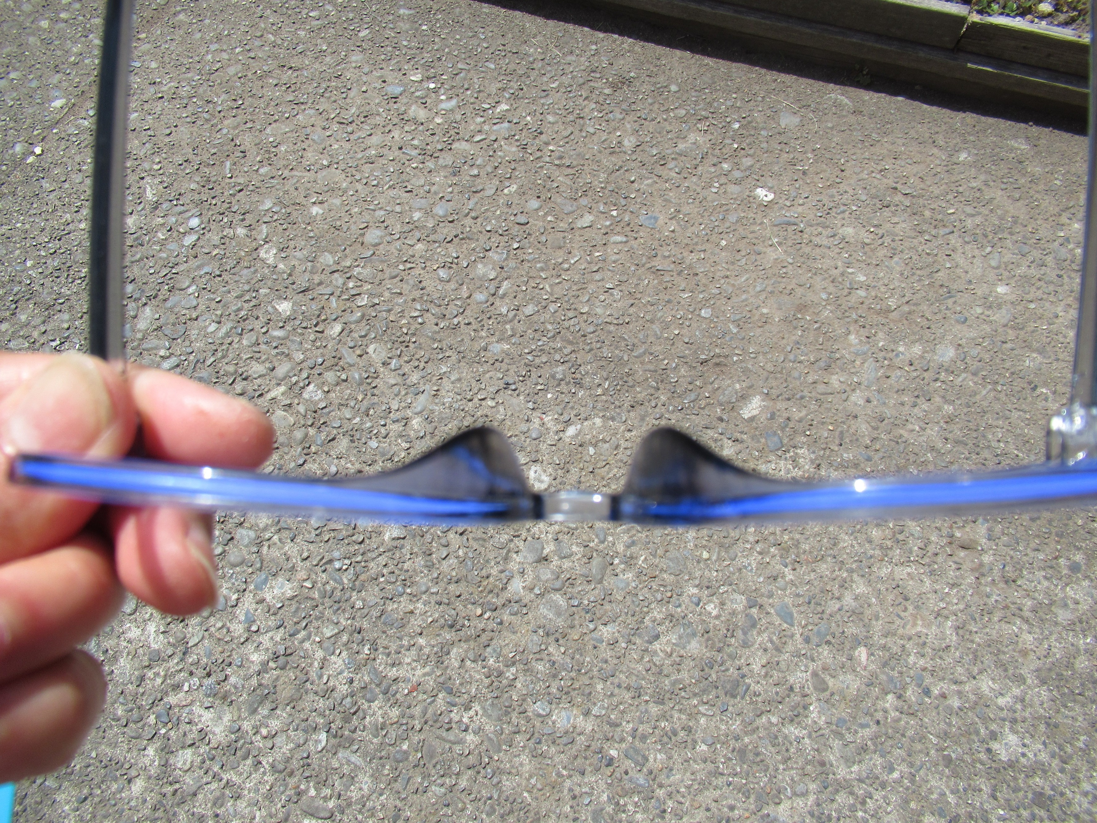 bottom view of blue-light-blocking glasses, showing layer of blue light filter in embedded in frames