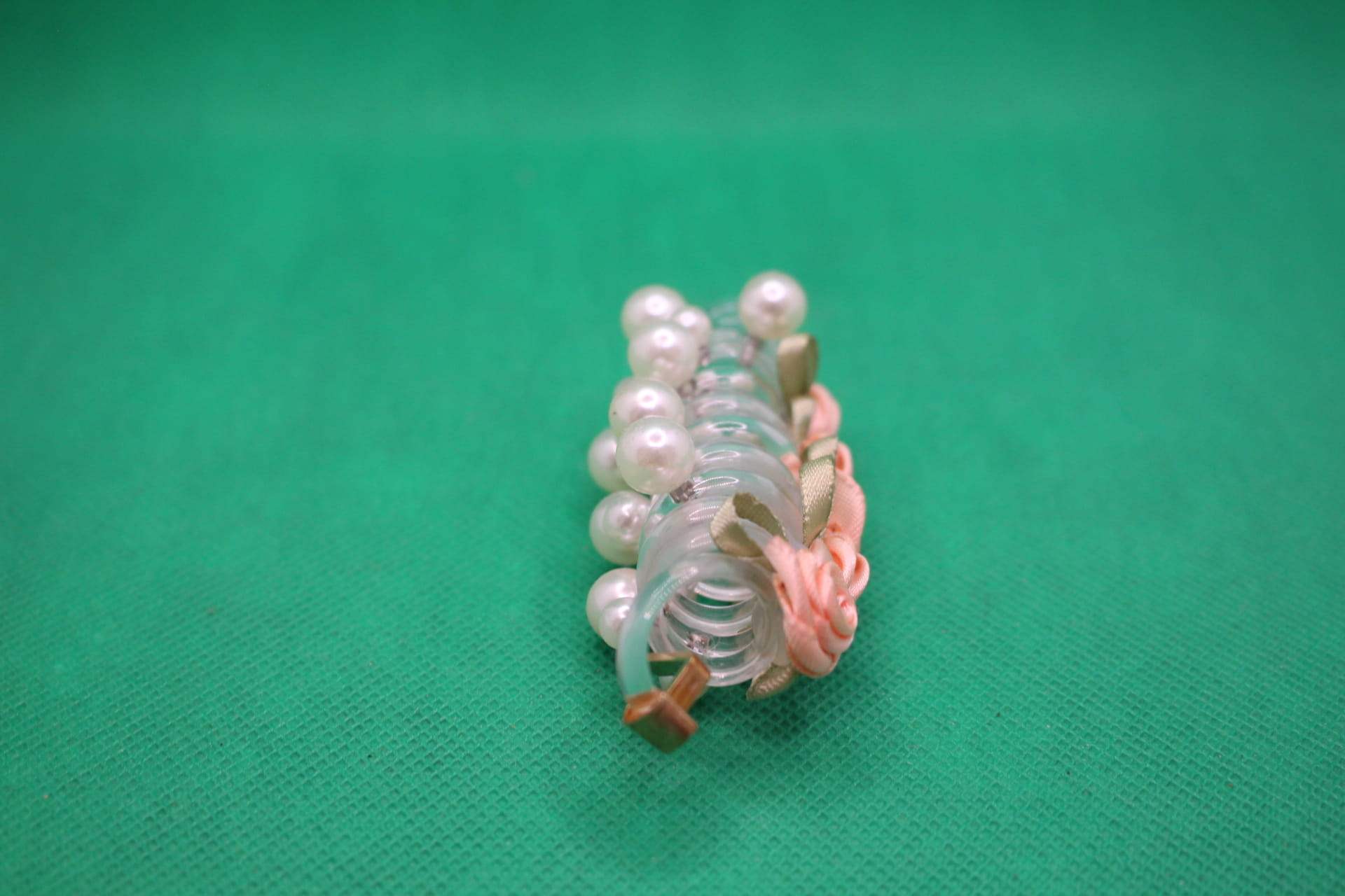 rose telephone cord hair tie side view -- peach color
