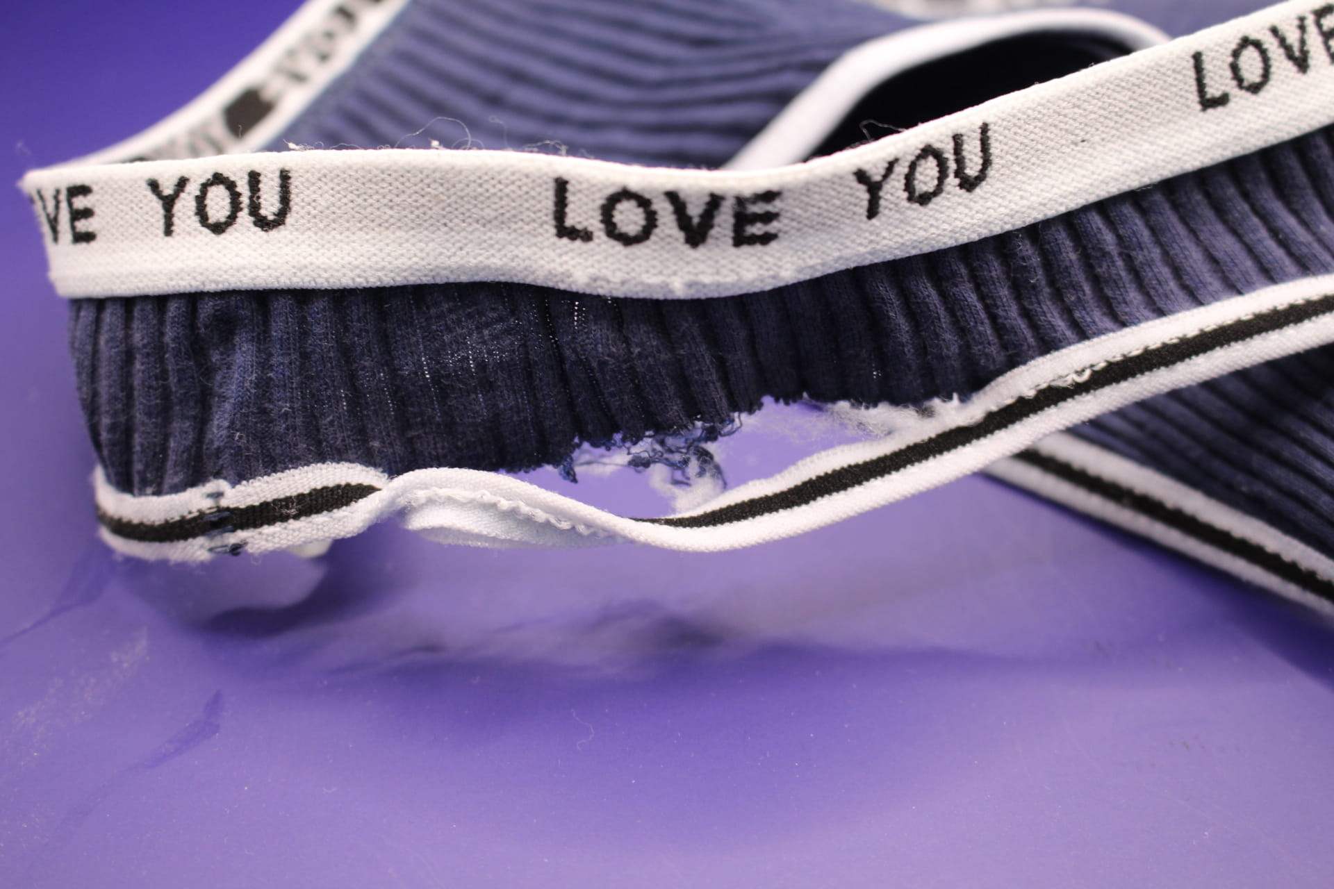 close-up of trn band in navy blue LOVE YOU panties from Temu