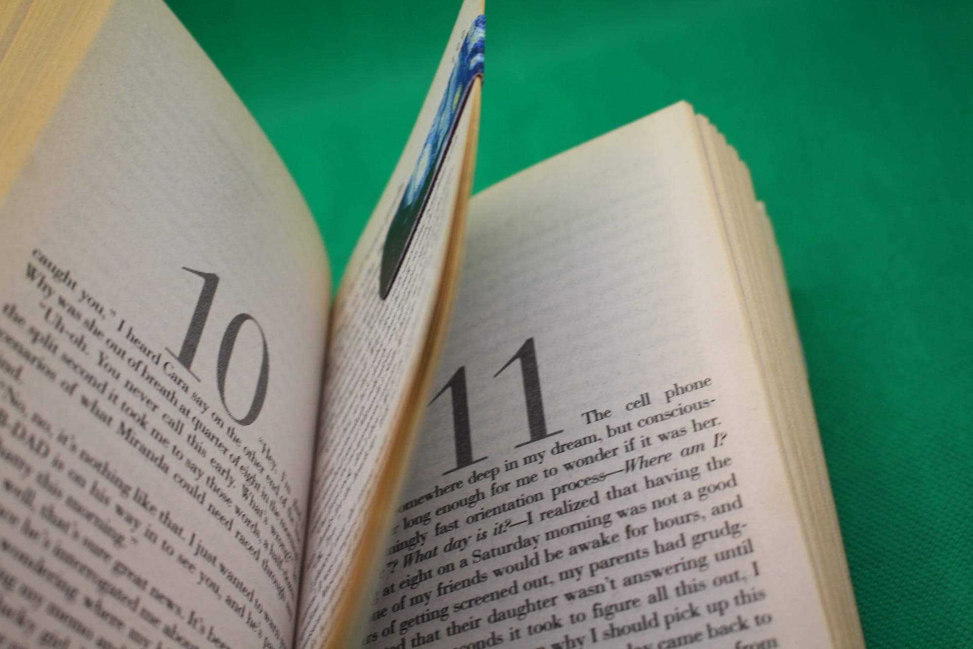 magnetic bookmark holding multiple pages of the book together