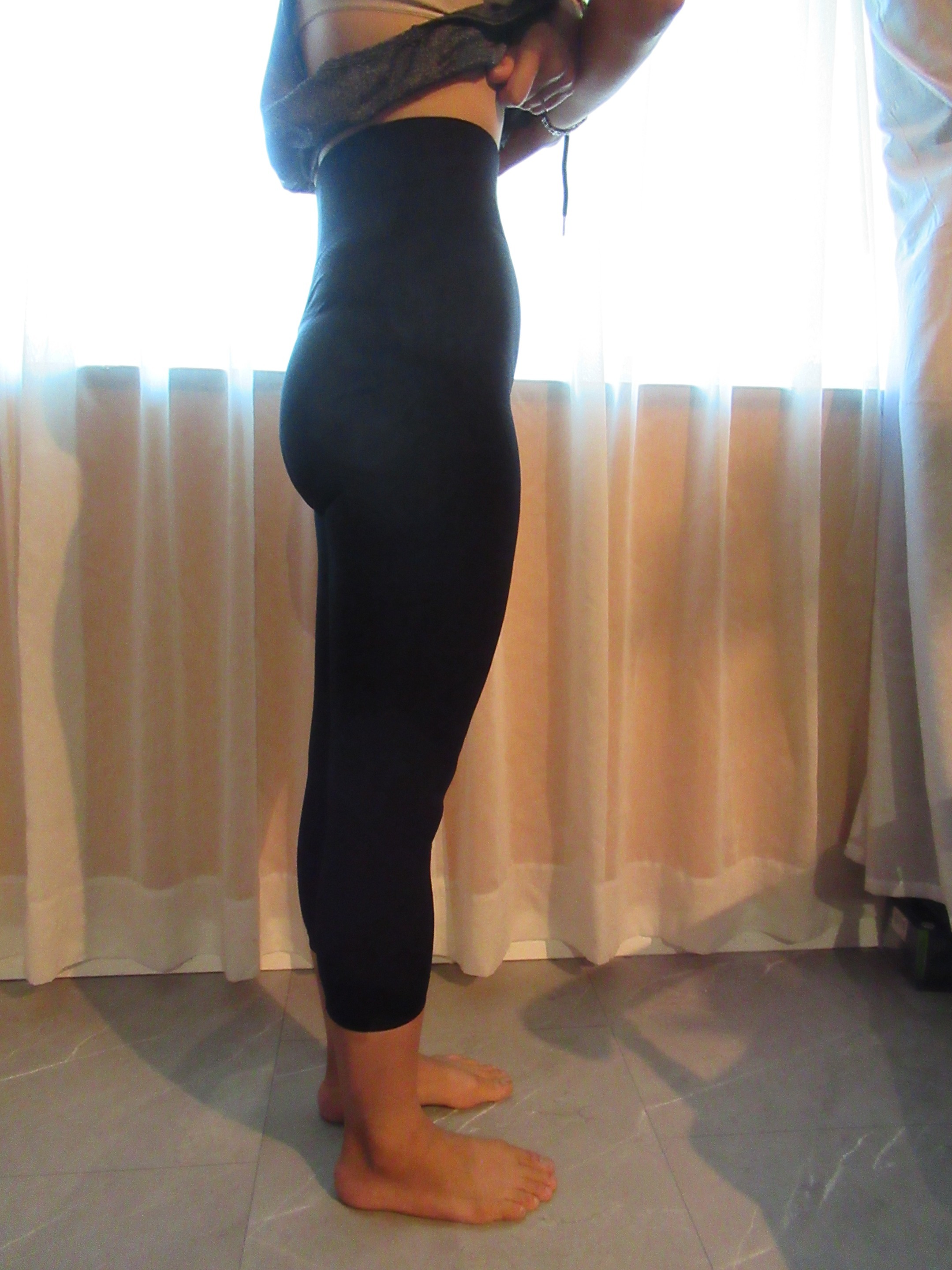 butt-lifting pants specifically designed to lift the butt, set of three -- black, side view; trying on, modeling butt-lifters on person