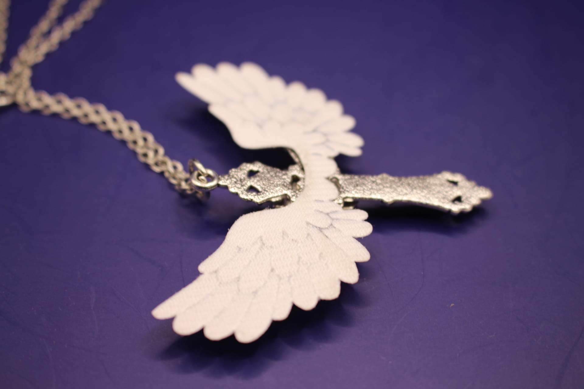 angel wing and cross necklace, side view