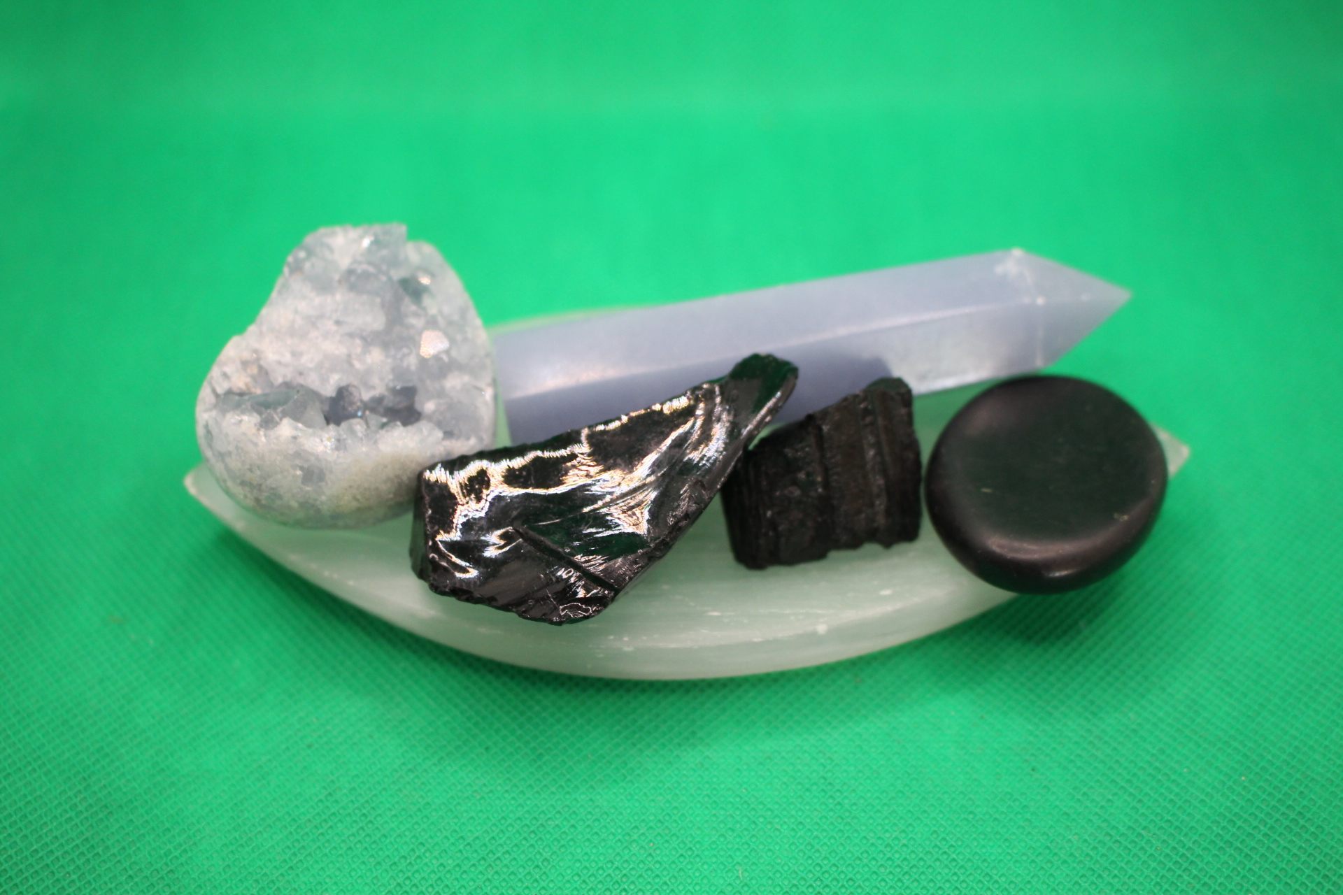 leaf-shaped selenite plate with crystals spread out on it, wide view