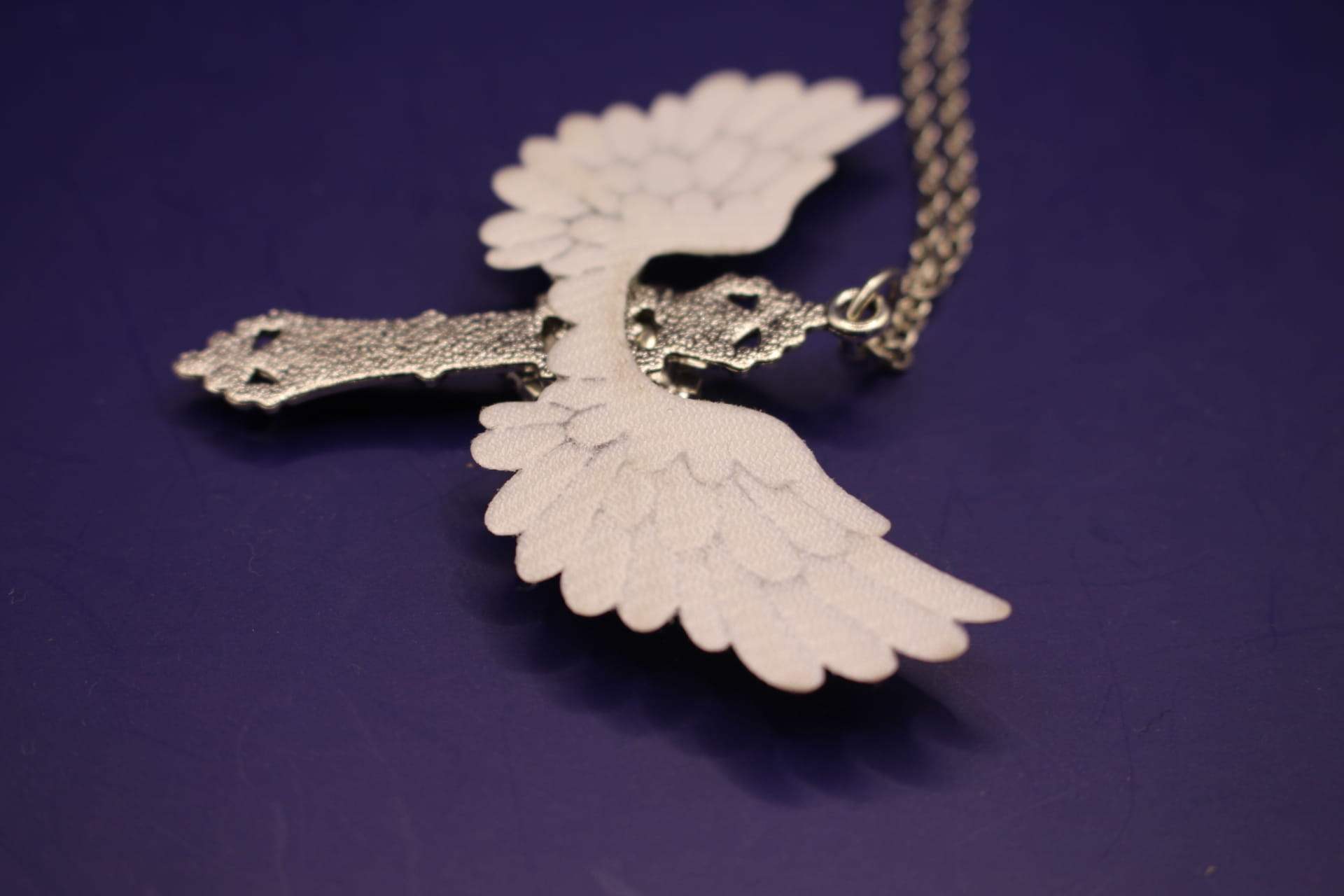 cross with wings necklace, side view