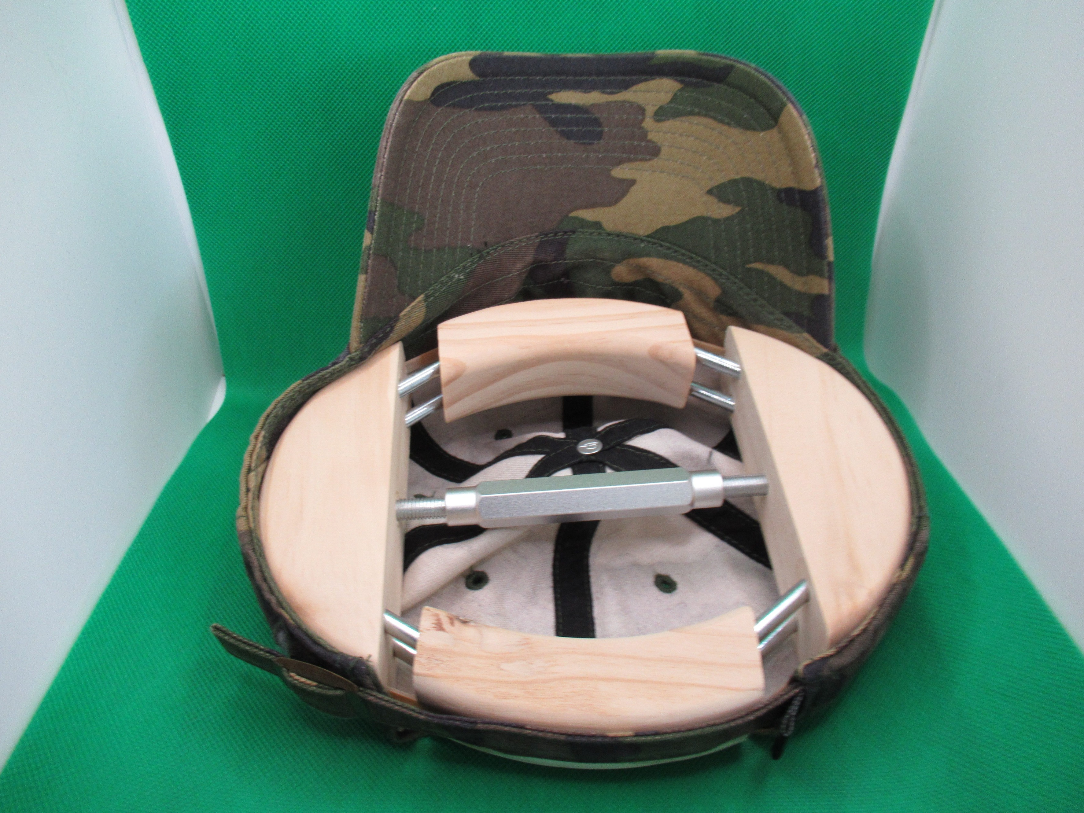 hat stretcher turned in a different orientation to create more width for my  hat