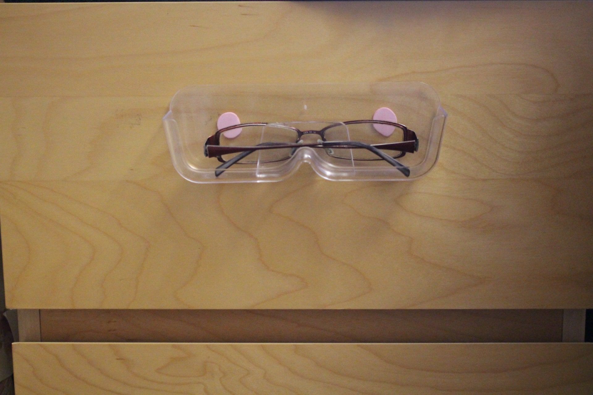 wall mounted eyeglasses holder with sticky tacky putty, on drawer
