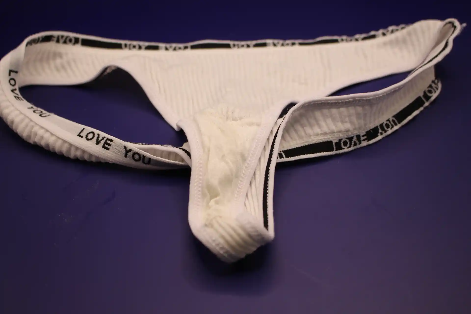 close-up of inside of cream colored cotton LOVE YOU panties for women  from Temu