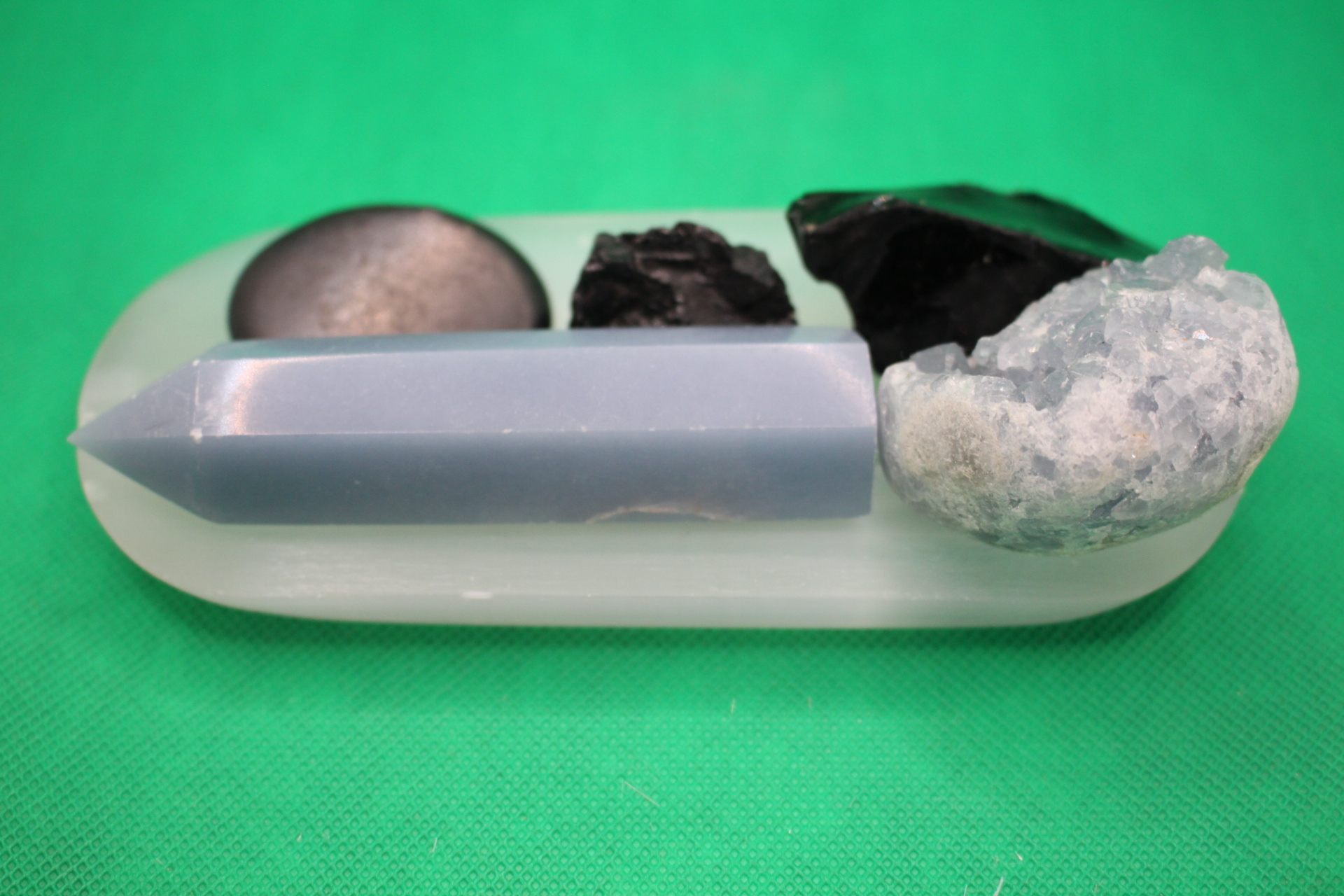 broken rectangular selenite plate long view -- with crystals on top