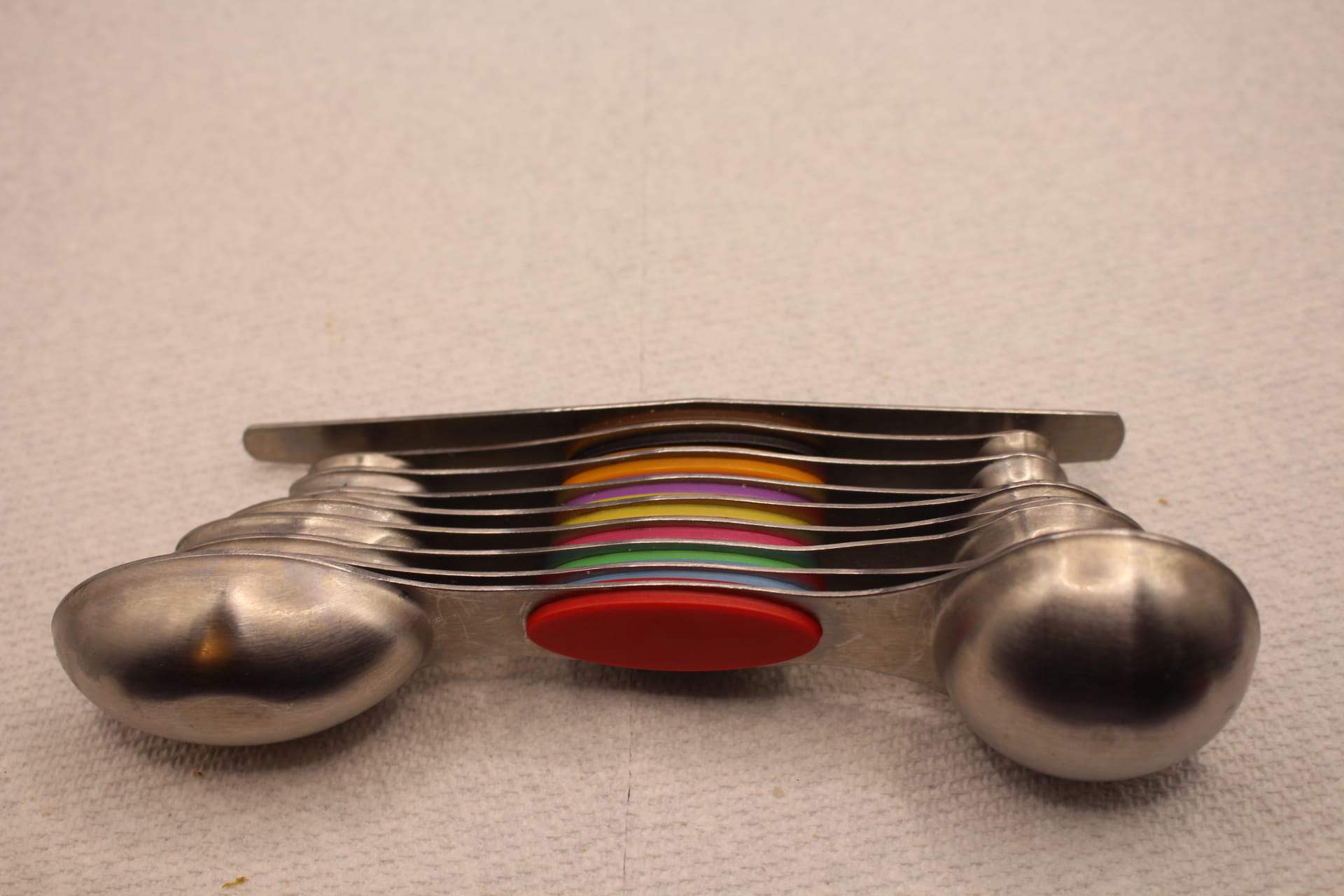 stacking magnetic measuring spoons set, showing bottoms of measuring spoons