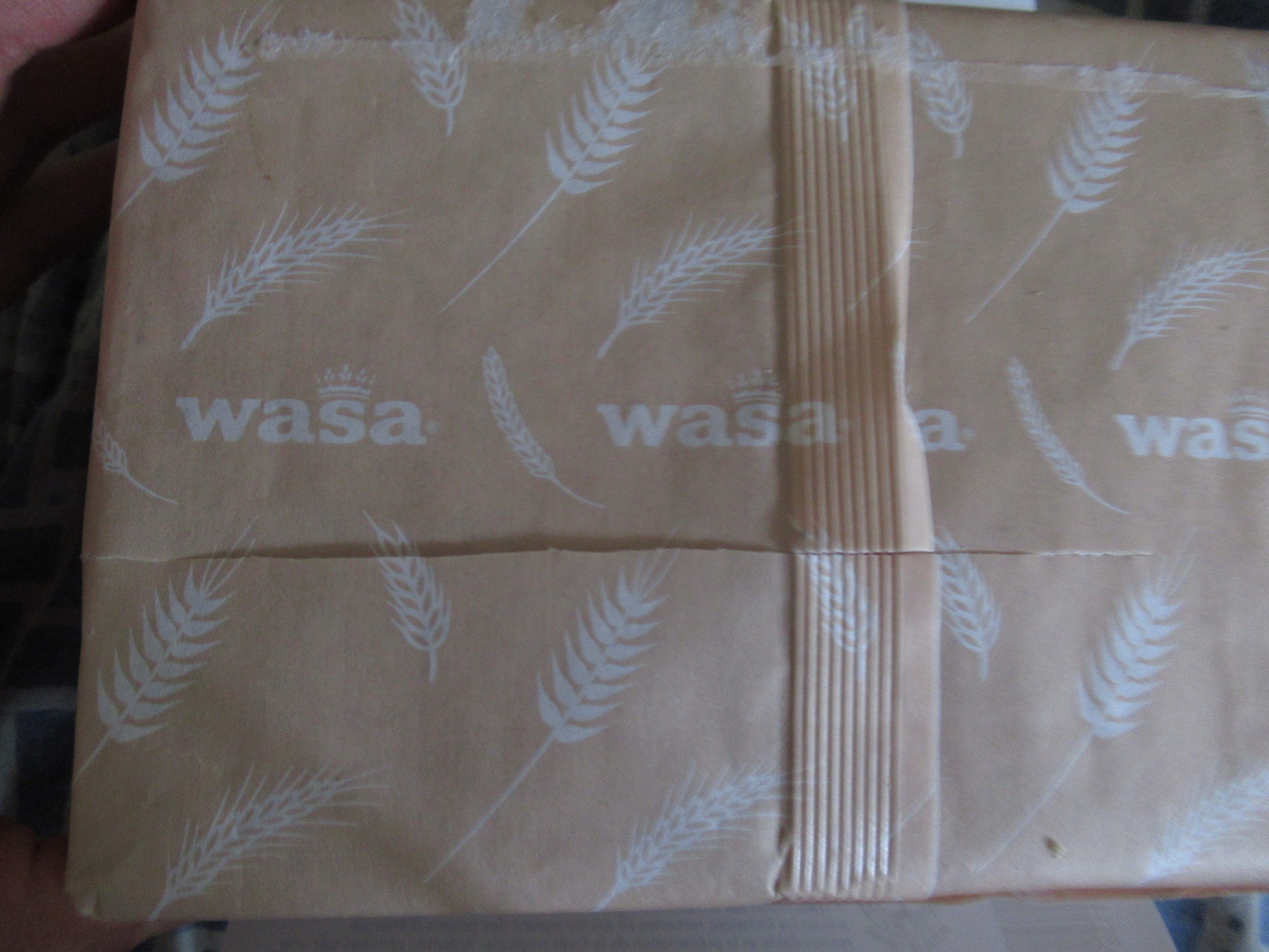 damaged Wasa light rye crispbread  bag -- sliced Wasa packaging inside