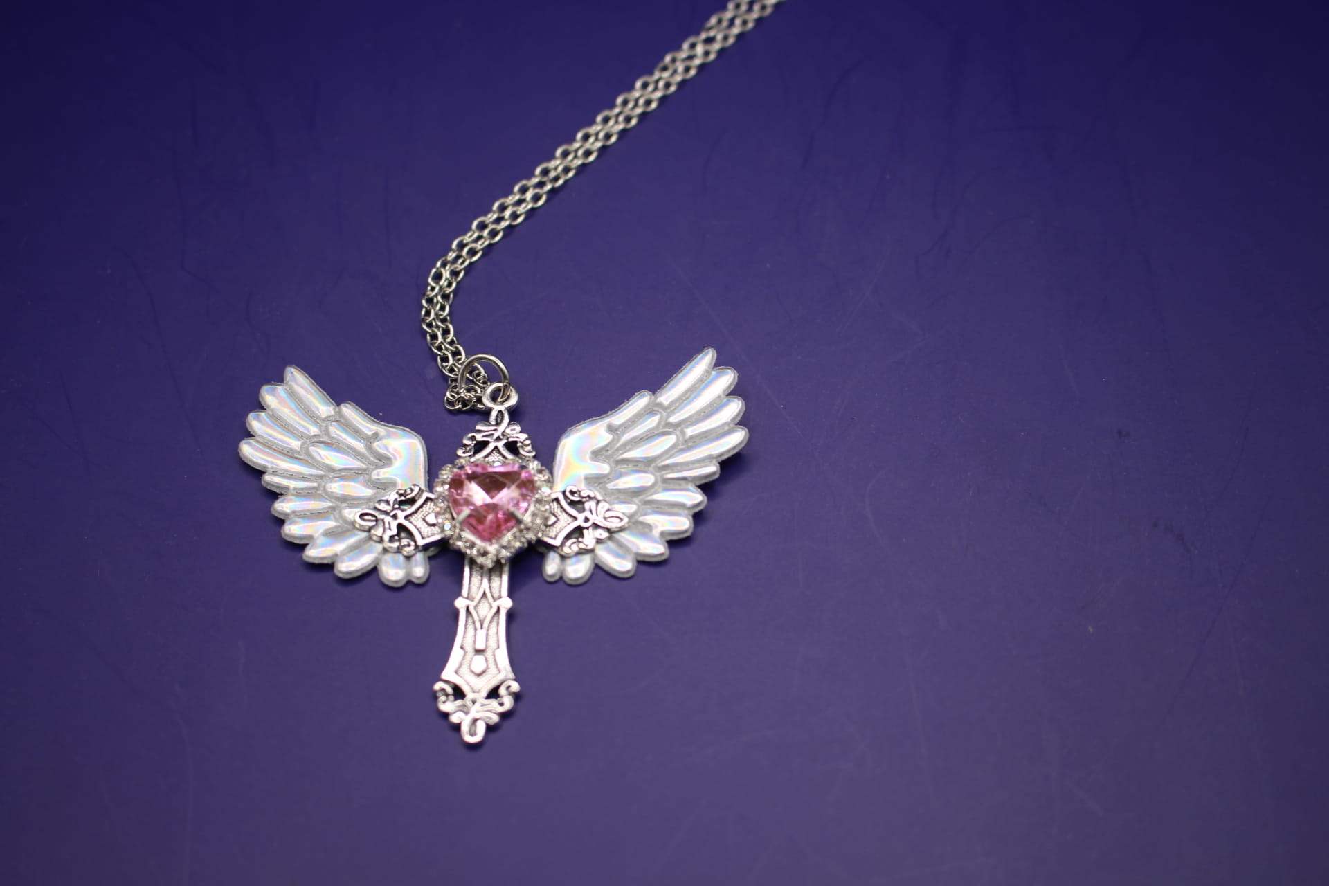 pink cubic zirconia cross necklace front view
