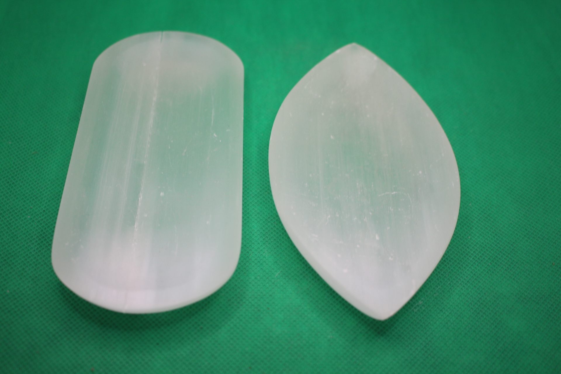 rectangular and leaf-shaped selenite plates side-by-side comparison, long view