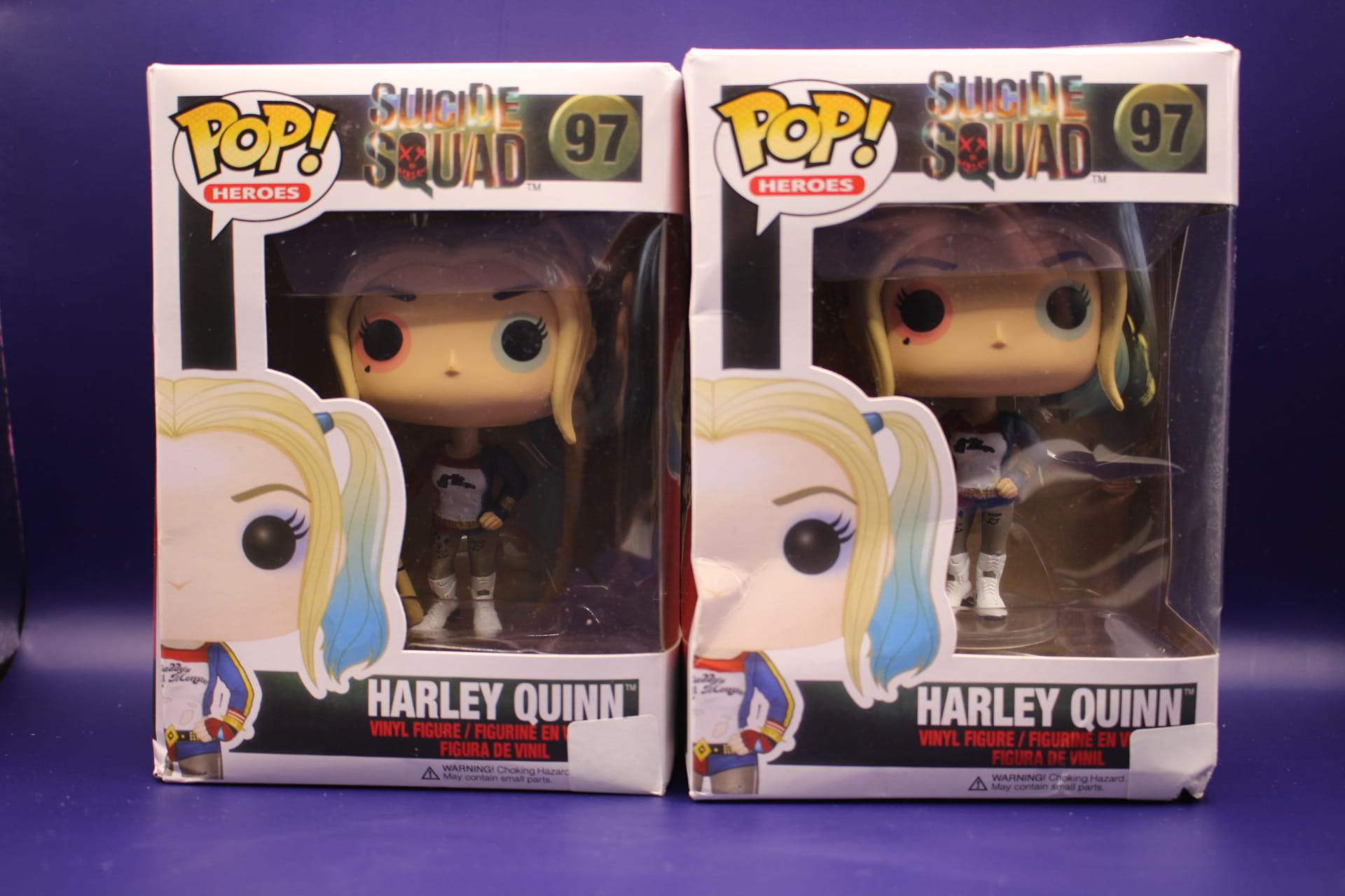 two Harley Quinn Funkos with damaged boxes from Temu, front view