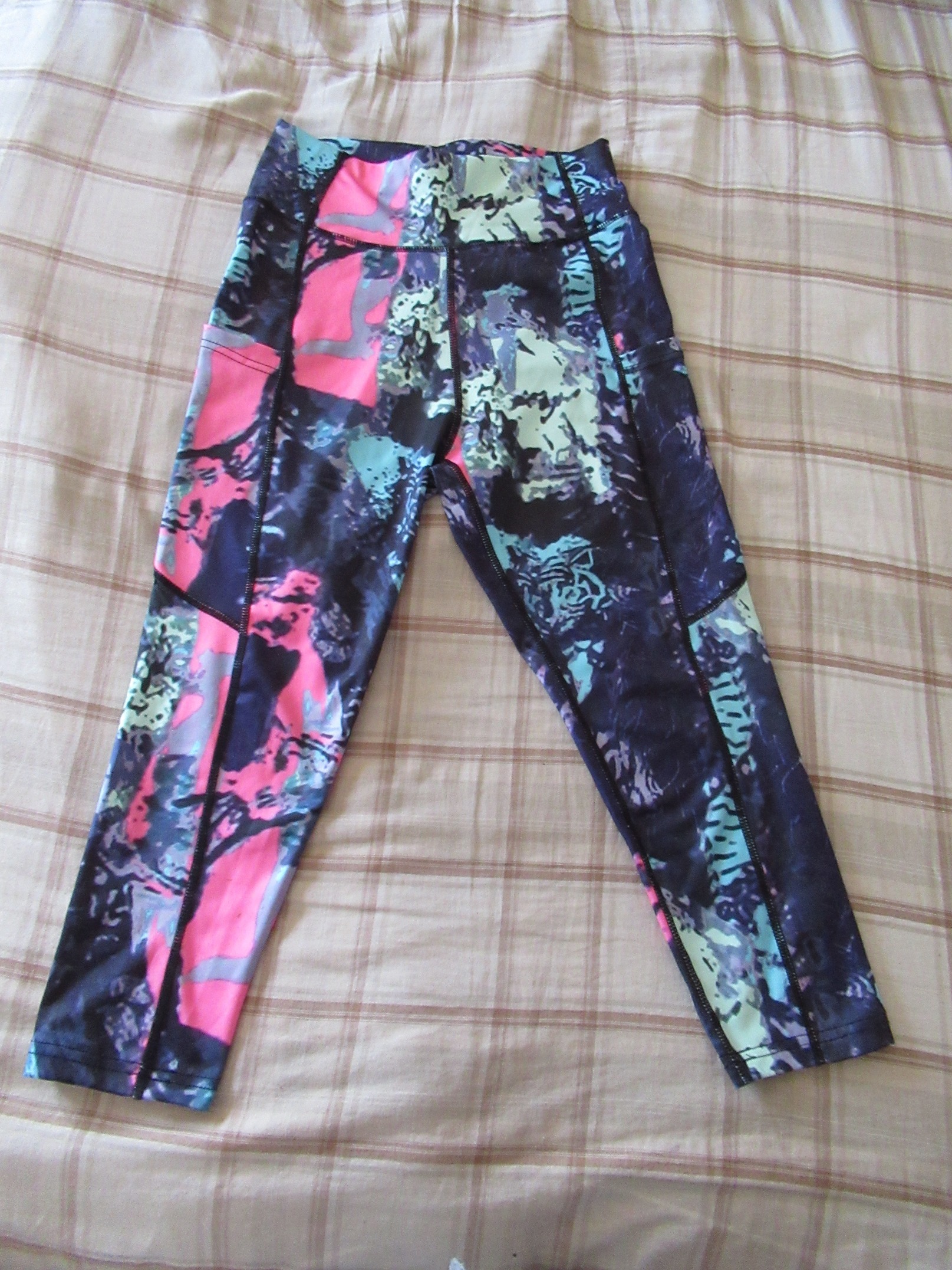 butt-lifting capri pants with big pockets set of three -- purple with pink/green/blue splash design, front view, butt-lifting capris alone