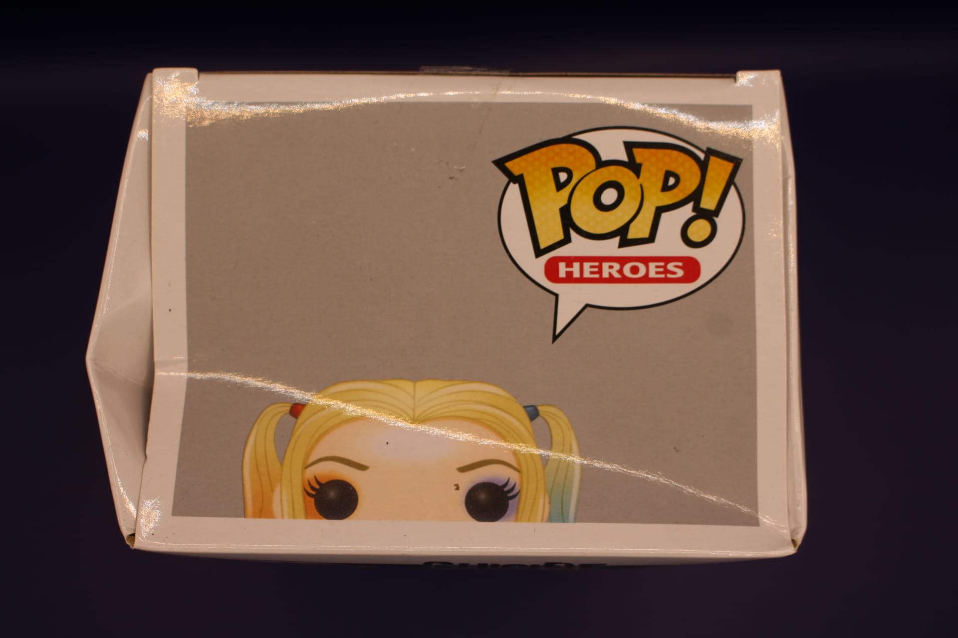 Harley Quinn Funko in box, top view