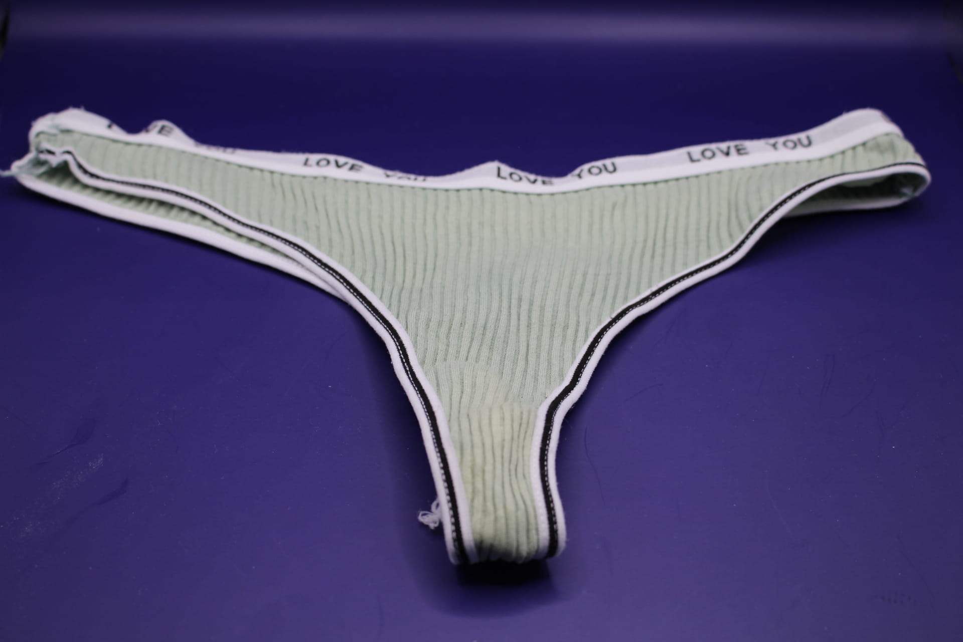 green LOVE YOU panties from Temu, front view