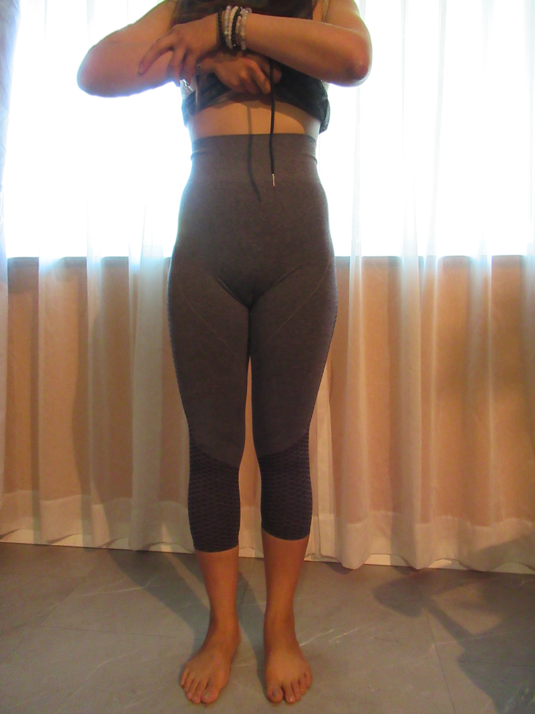butt-lifting pants specifically designed to lift the butt, set of three -- grey, front view; trying on, modeling butt-lifters on person