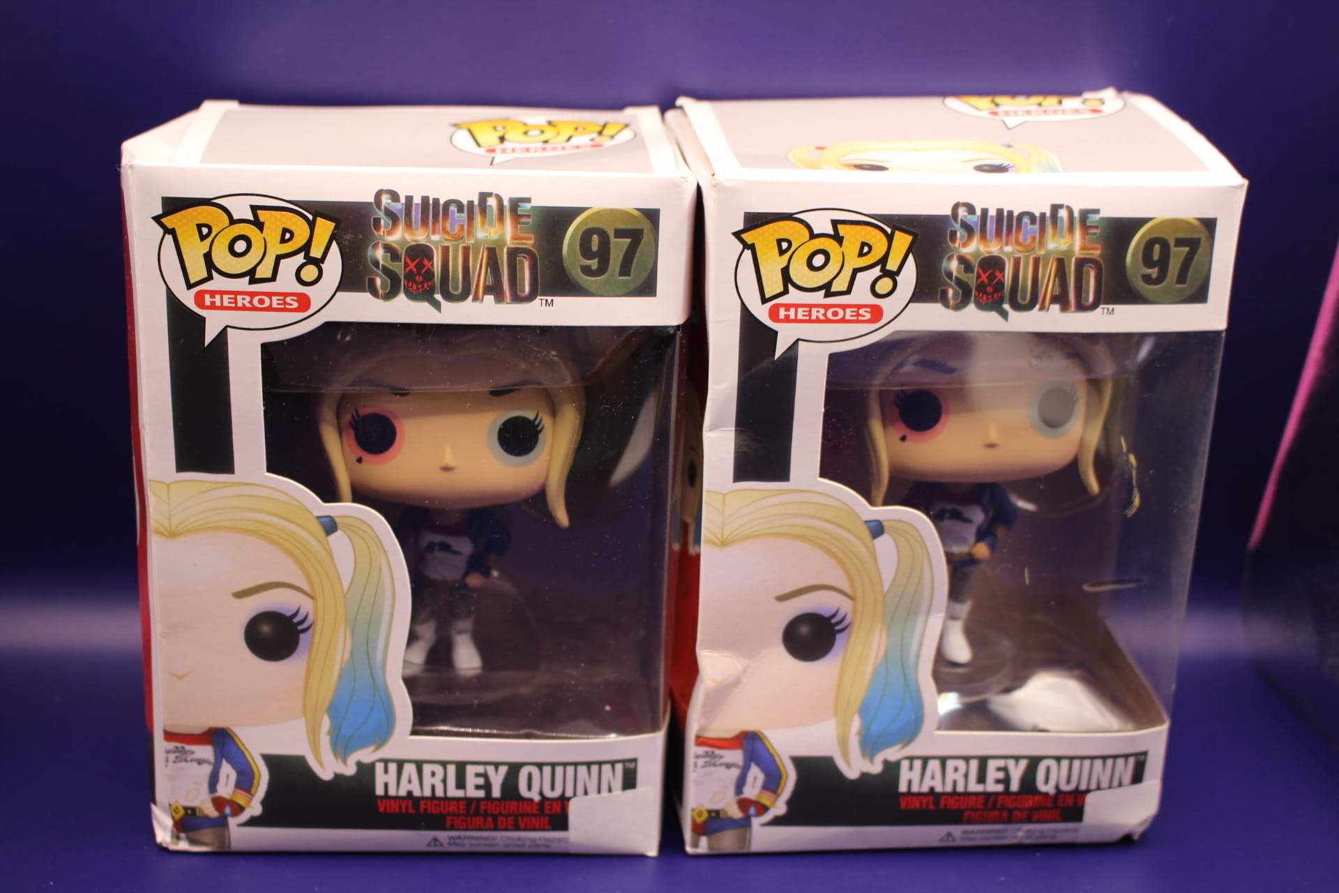 two Harley Quinn Funkos with damaged boxes from Temu, front and overhead view