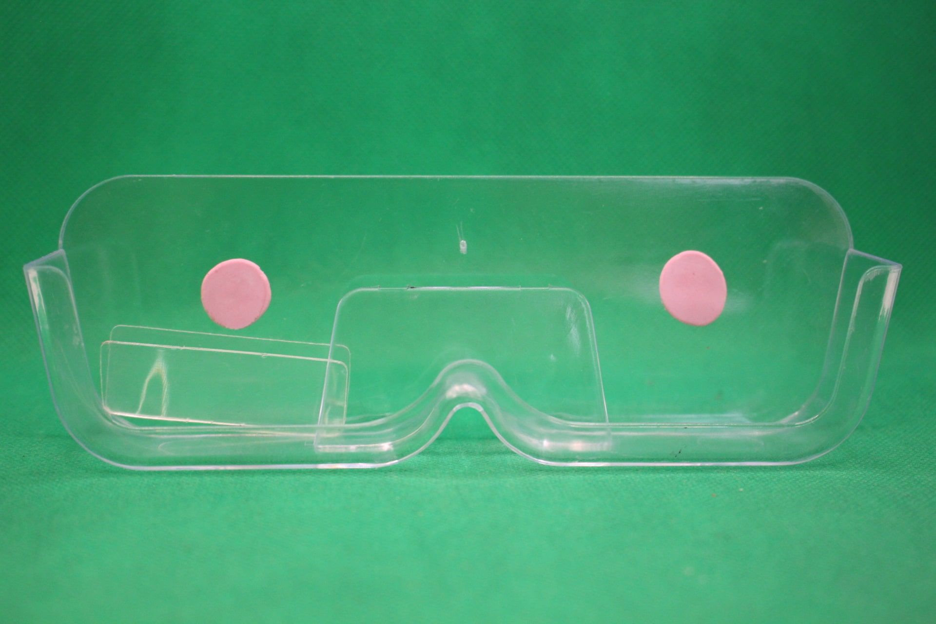 wall mounted eyeglasses holder with sticky tacky putty, and unused adhesives in left side