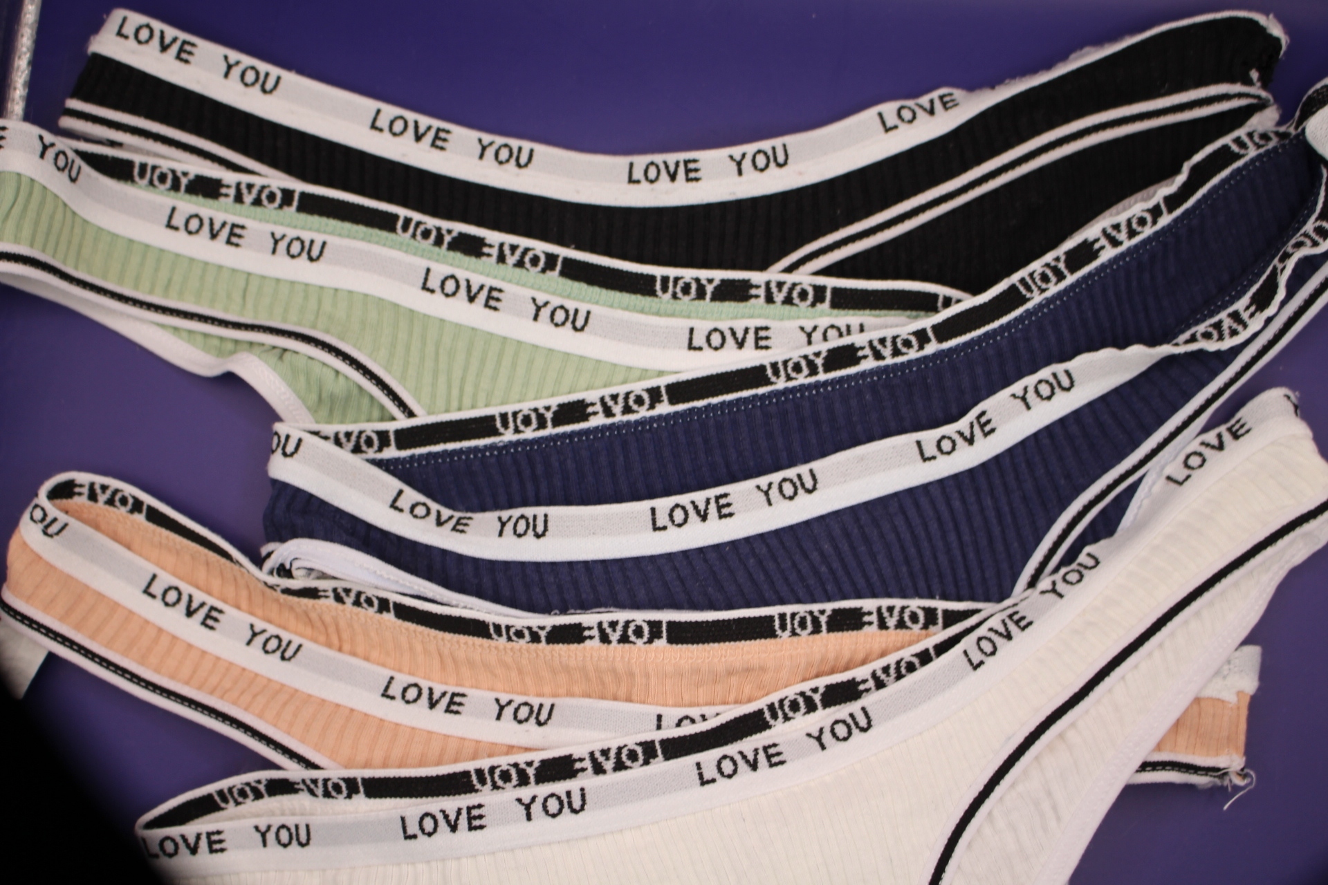 close-up of cotton LOVE YOU panties for women, 5 out of the 6 assorted colored panties in the set