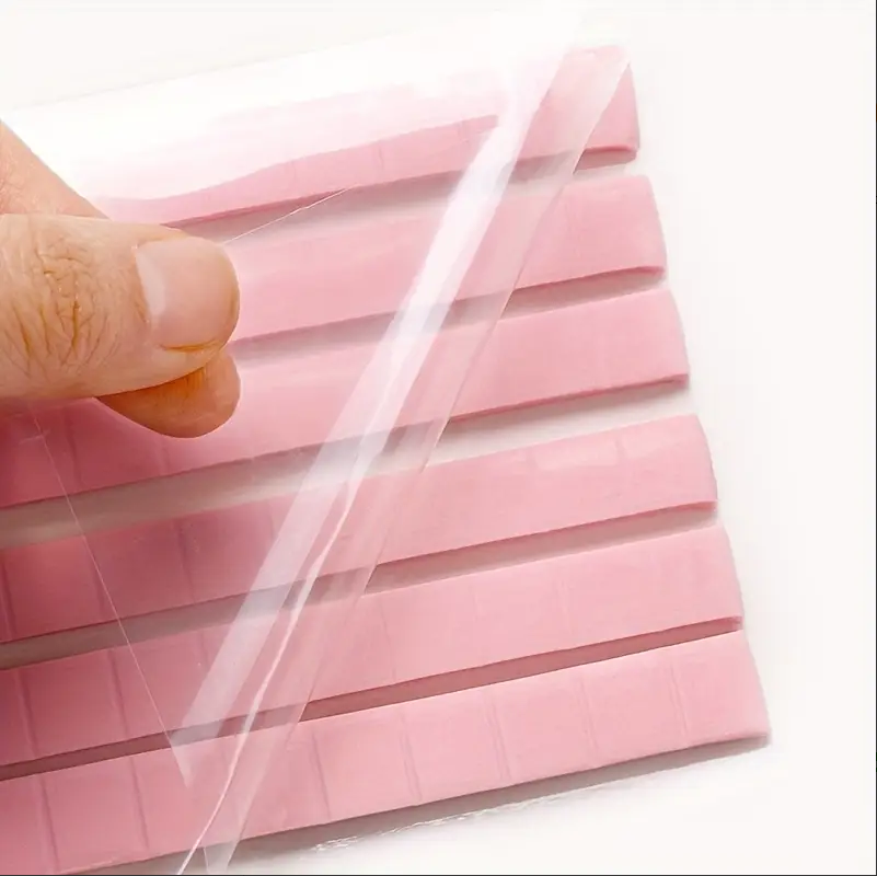 sticky tack showing film backing