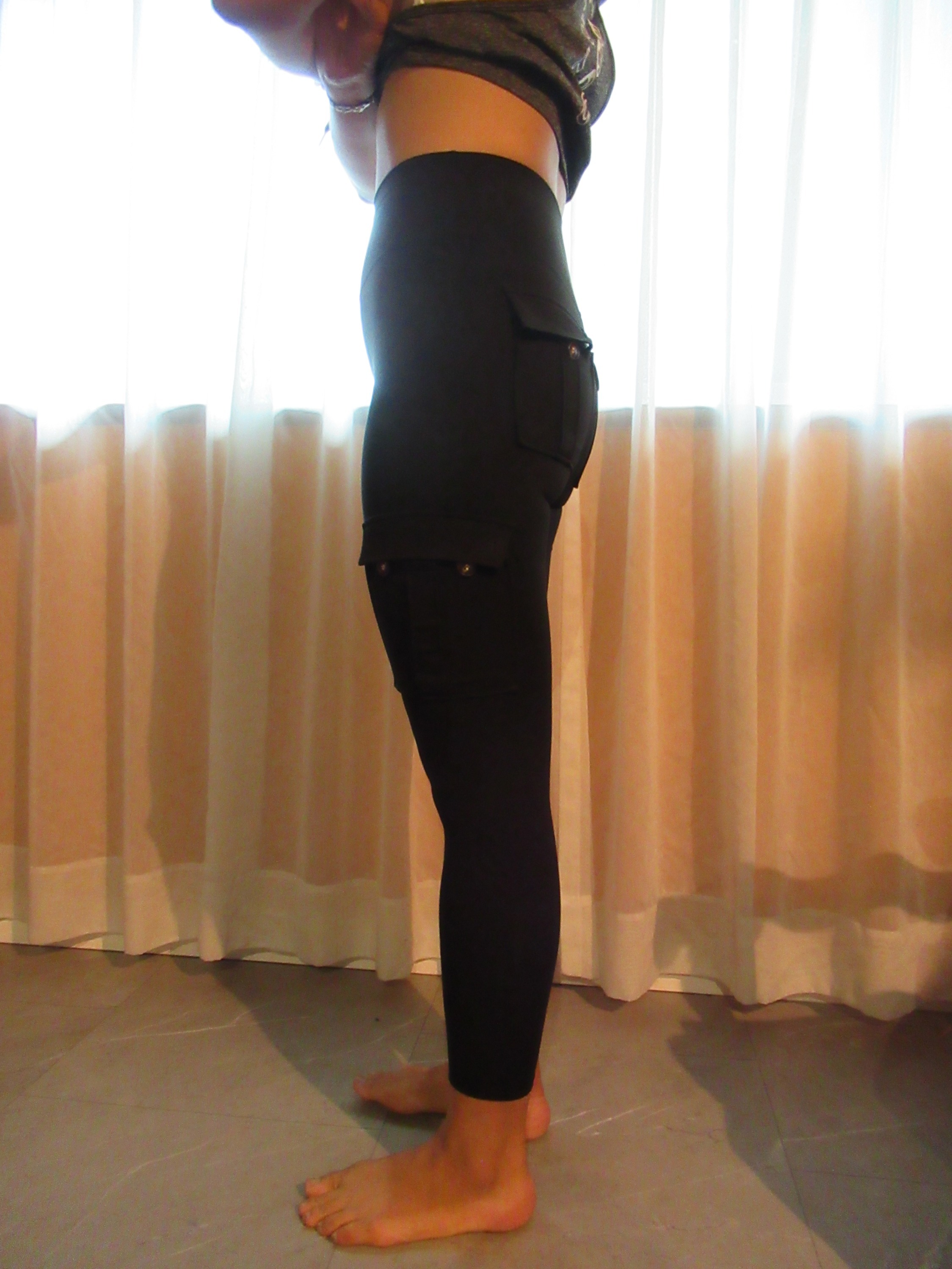 modeling cargo butt-lifting pants with pockets from Temu -- left side view