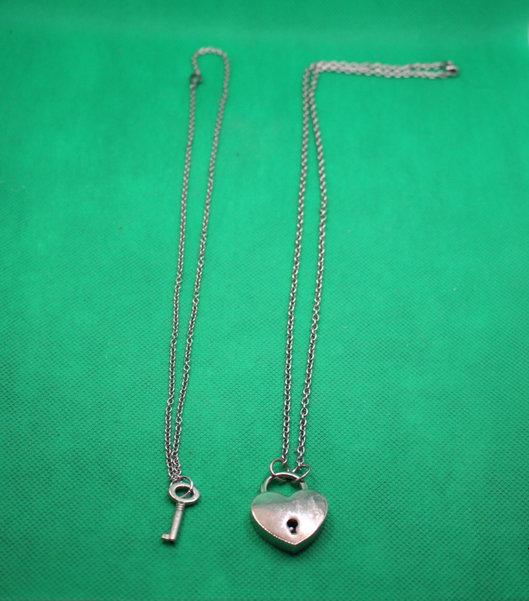 heart lock and key couple necklaces; side by side comparison showing different lengths of chains