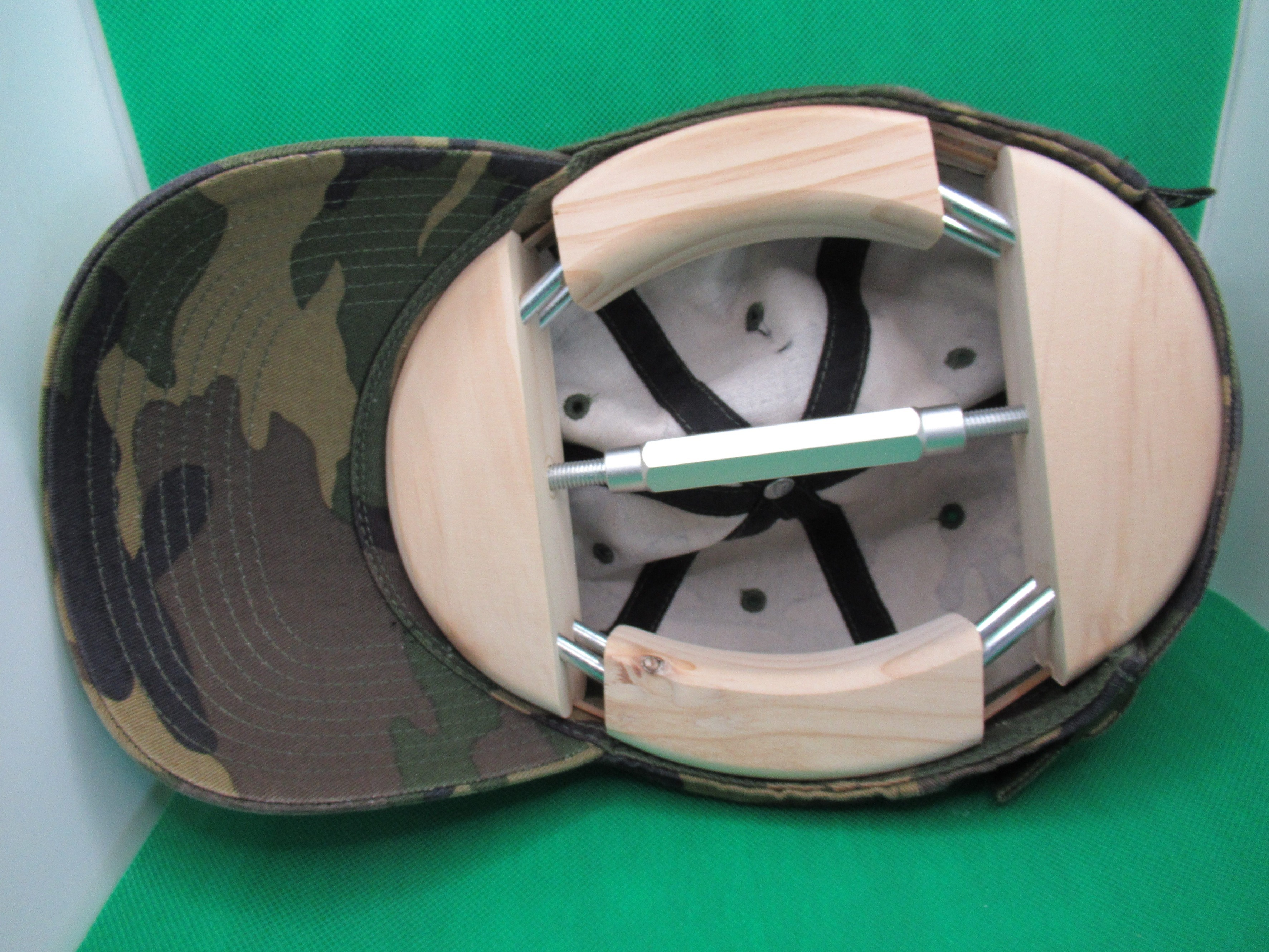 hat stretcher in baseball cap at maximum extension
