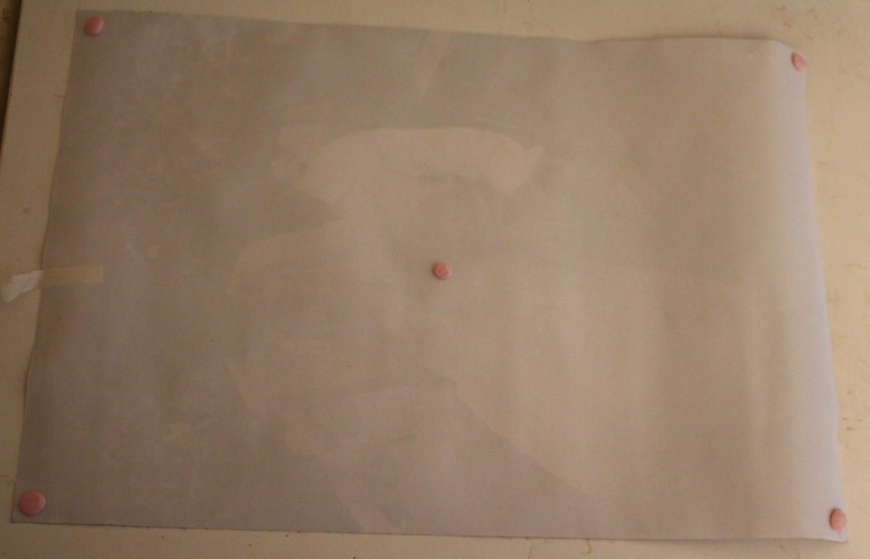 back of Nancy and Ronald Reagan canvas poster with sticky tacky applied to the back corners and center
