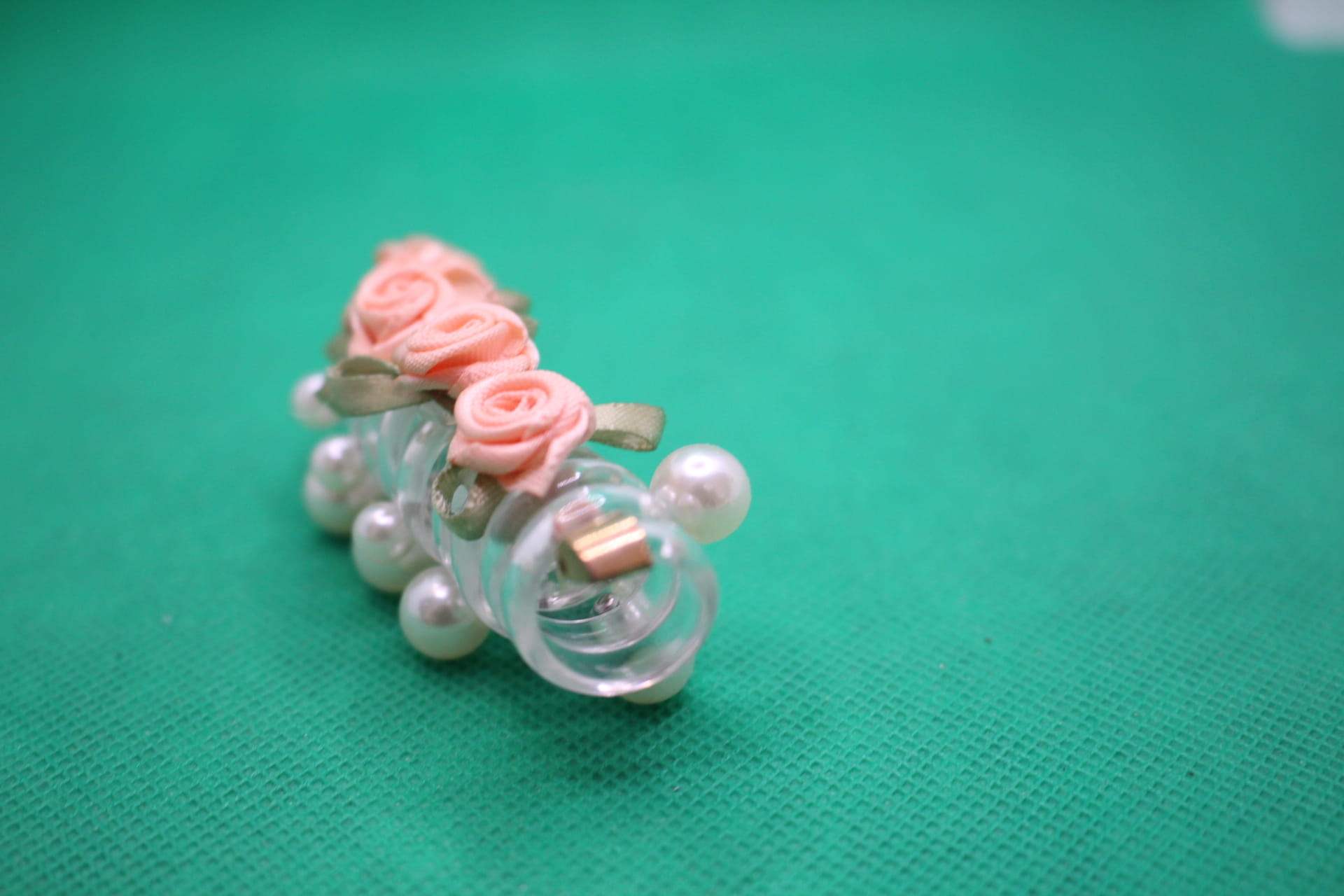 rose telephone cord hair tie diagonal view -- peach color