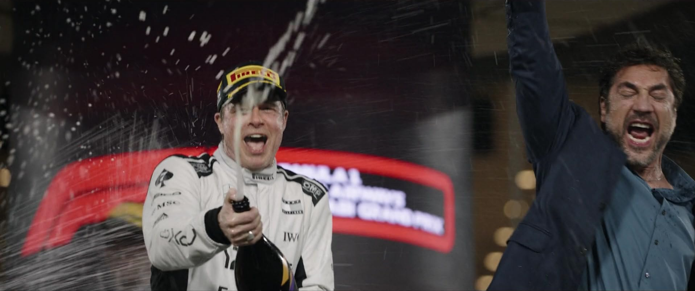 Sonny and Reuben celebrating the team's victory in F1 The Movie, taken from IMBD page